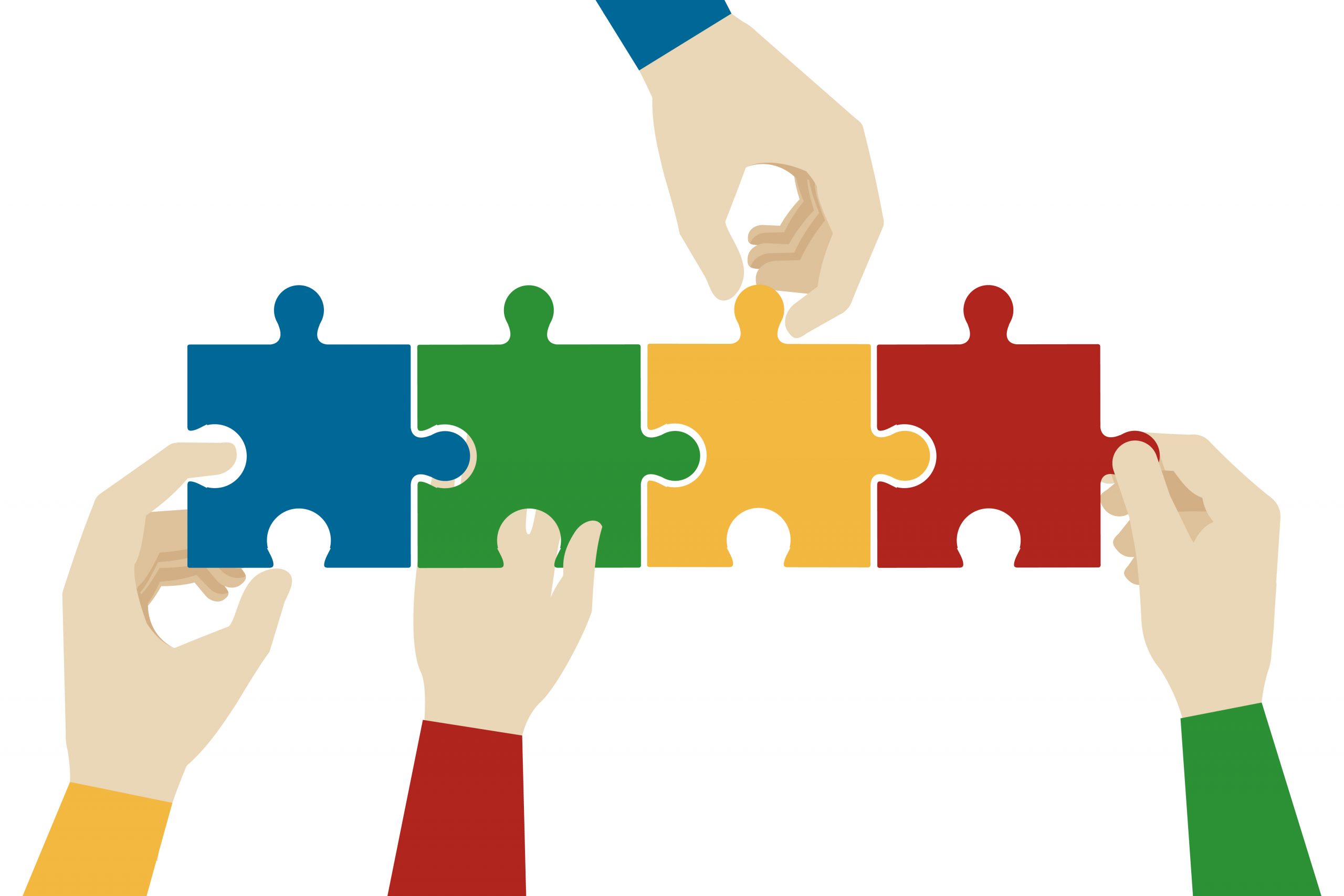 Hands assembling jigsaw puzzle pieces